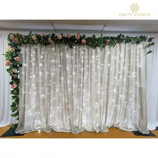 Illuminated Curtain with Floral Garland Back Drop 