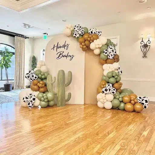Rustic "Howdy Baby" Backdrop with Cactus and Balloon Accents 