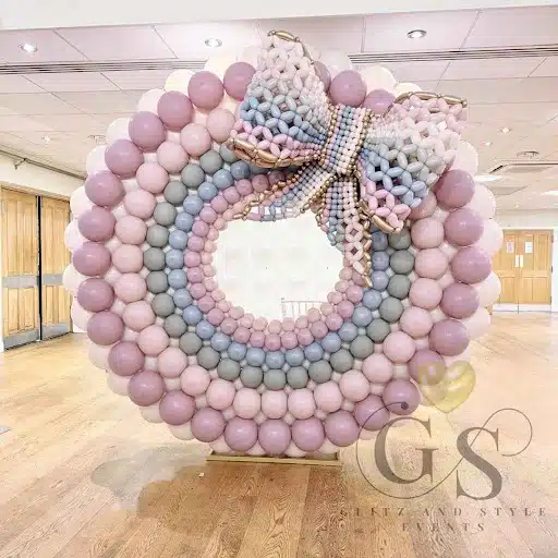 Whimsical Balloon Wreath with Elegant Bow back drop