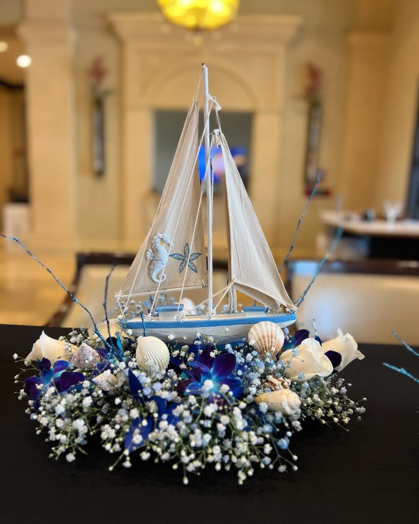 .Set Sail for Sweet Arrivals: A Nautical Blue Centerpiece