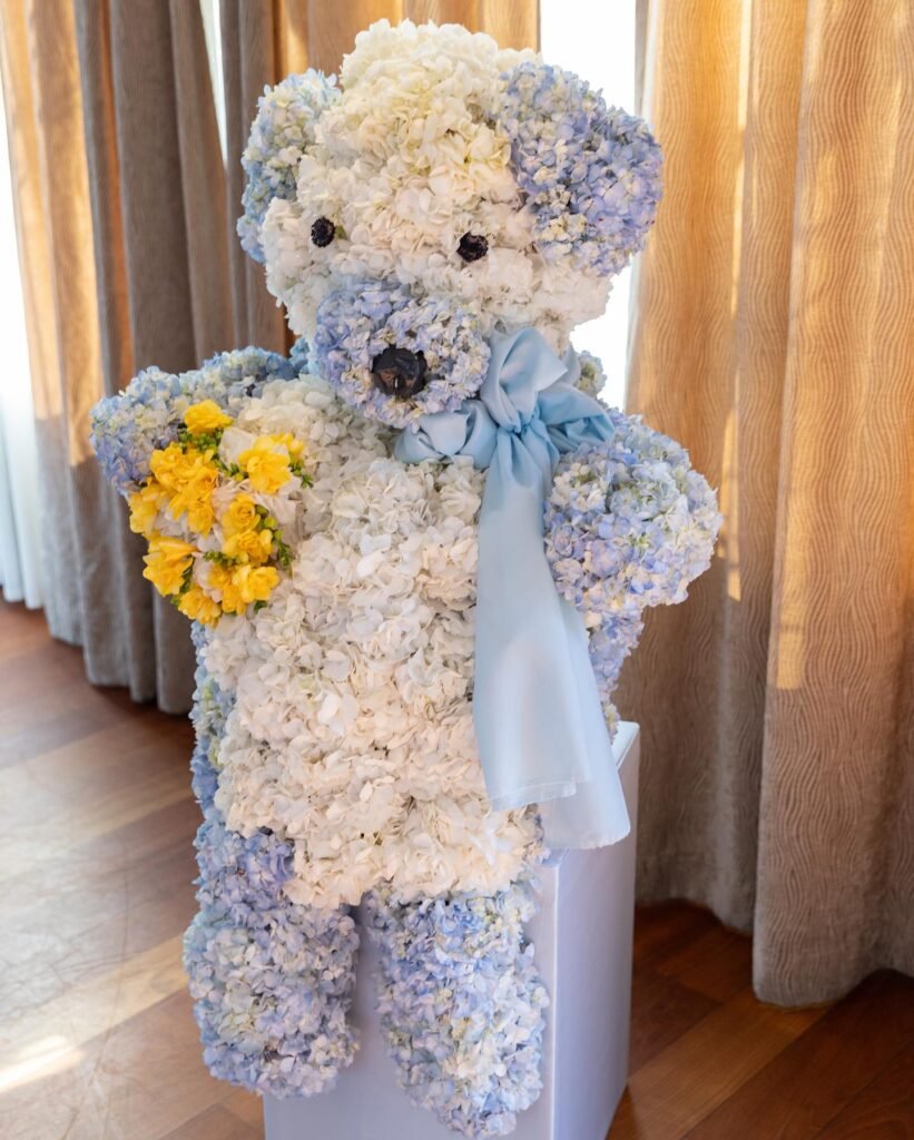 A Blooming Teddy Bear Hug in Blue and White
