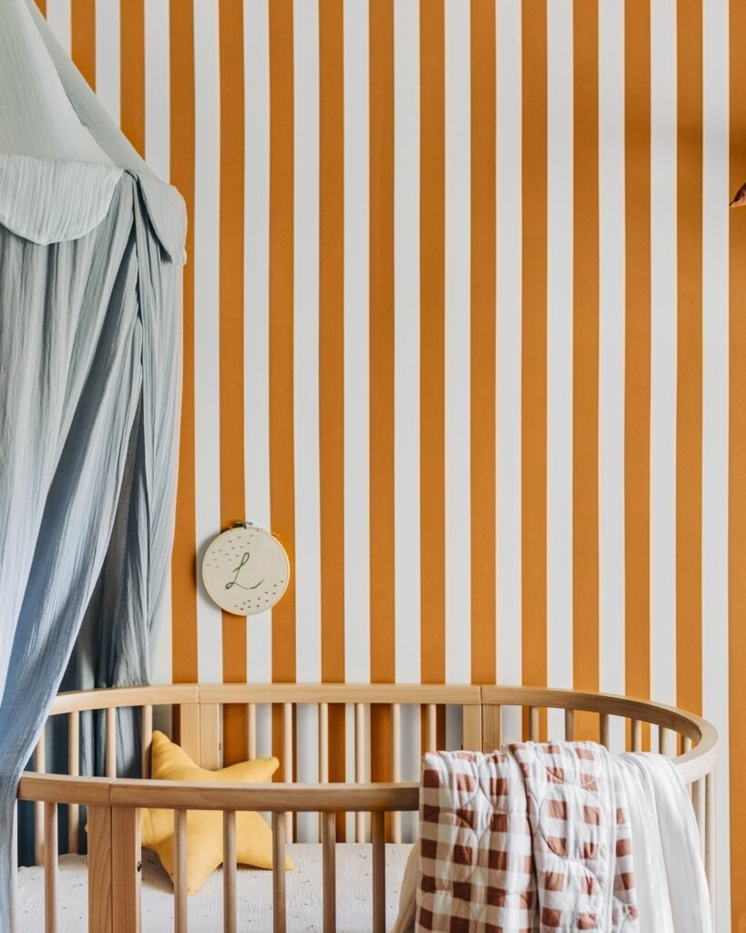 A Nursery with Playful Details and Sunny Stripes