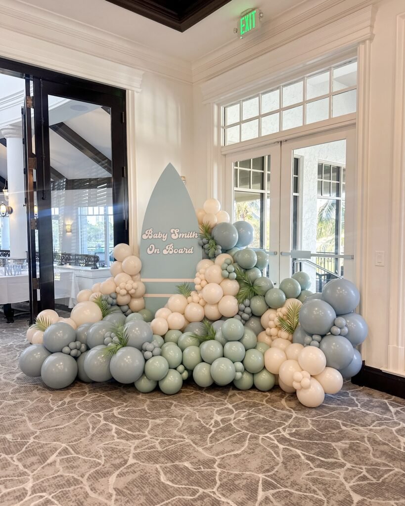 Riding the Wave of Love! A Chic Surfboard Welcome with a Modern Balloon Garland